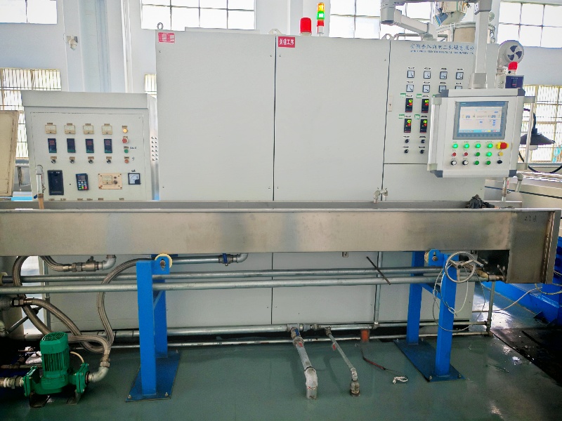 Wire and cable extrusion machinery on factory floor